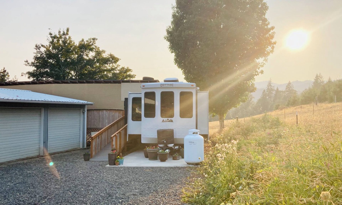 Ariel House | Glamping at Coyote Ridge! Camp out in style in a luxury cottage RV! W/firepit