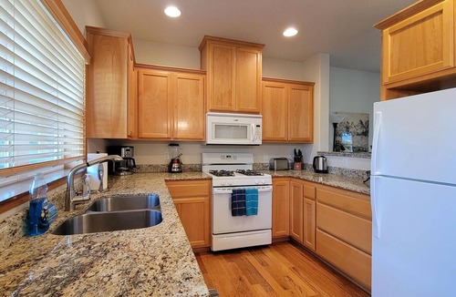 Historic Downtown District Apartment | 2-story, 3 bedroom modern home with king and queen beds, living room and kitchen.