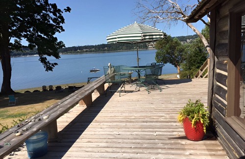 Rollingbay Cabin | Bainbridge Island Water's Edge Log Cabin just feet from the beach! Pet Friendly