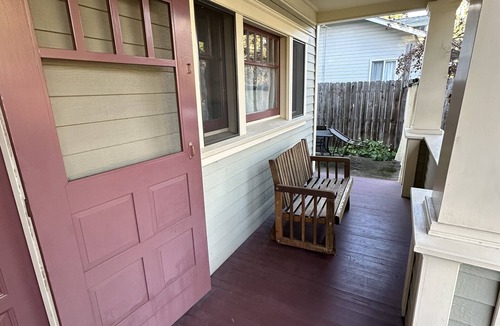 Jacksonville Cottage | Charming Jacksonville cottage with a front porch, full kitchen, off-street parking, and walkable access to Britt Festival, downtown shops, restaurants, and wine tasting. Features two bedrooms, two bathrooms, and peaceful historic charm.