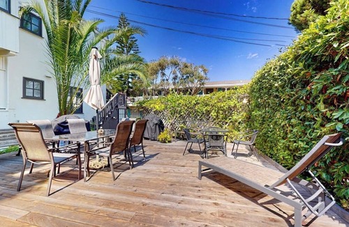 East Beach Apartment | Classic beach suite 1 block to ocean - fireplace, lovely patio, near downtown