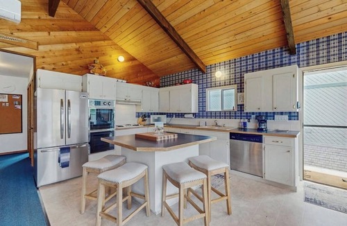 Orondo House | Dog-friendly waterfront home with pool, tennis courts, & large lawn