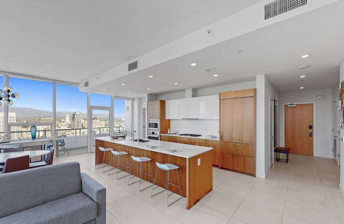 Downtown Los Angeles Apartment | Enjoy city views from our three bedroom suite, private balcony & 2 deluxe baths
