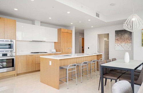 Downtown Los Angeles Apartment | Enjoy corner city views with two king beds and two bathrooms.