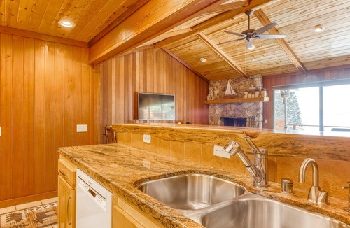 Brockway Condo | Lakeside condo with water views, private beach, dock, buoy, and wood fireplace