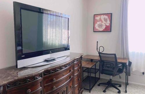 Riverside House | Large master bedroom with Separate bathroom and work desk on the first floor