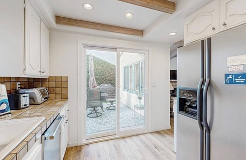 East Beach House | Lovely home with furnished patio, grill & ocean views - close to the beach