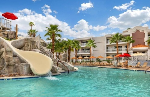 Canyon Corridor Hotel | Modern Suite with Private Balcony and Gorgeous Pool Views for Relaxation