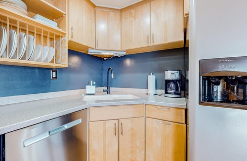 Adelma Beach House | Modern water view retreat with foosball table, expansive deck, and gas fireplace