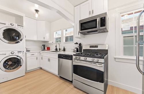 Eastside Apartment | Oversized Furnished 1BR in Rose Park with King Bed, W/D & Parking