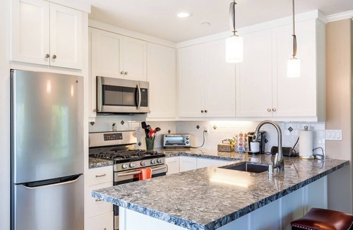 West Newport Apartment | Perfect Spot! 1 block to beach, garage, private deck, bikes & beach toys!