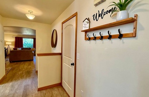 Olympia House | Spacious modern family home with open living, full kitchen, office nook, and private access