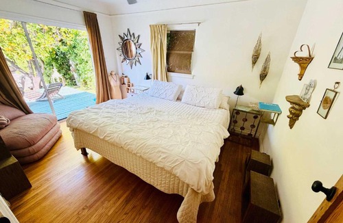 Palms House | West LA Bungalow with Lush Garden by Colby and Conrad