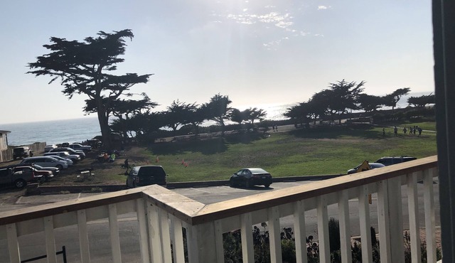 Beachfront home directly across from beach & park! Close to everything!