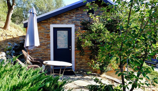 Charming stone clad cabin with views off Highway 140 towards Yosemite in Midpines