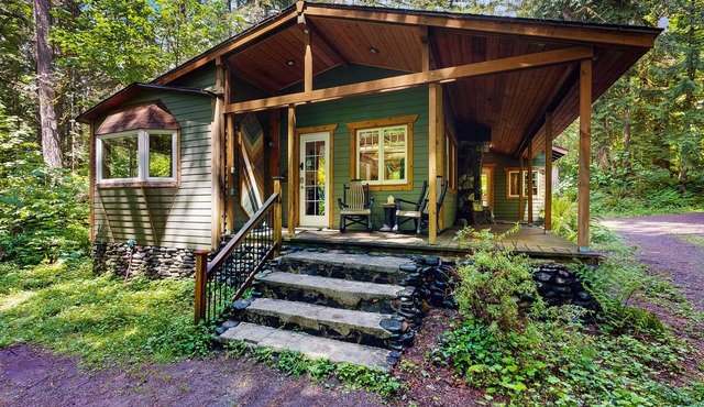 Cozy Riverfront Cottage with Charming Interior & Hot Tub - Dog-Friendly