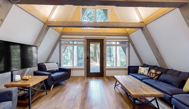 Dog-friendly A-frame near the river with game room, firepit, wood stove, & grill