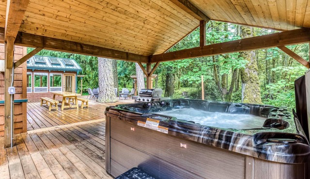 Dog-friendly creekside home with entertainment barn, private hot tub & firepit