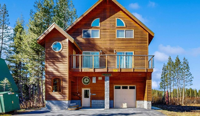 Family-friendly, lakefront getaway with a gas fireplace, furnished deck, & views
