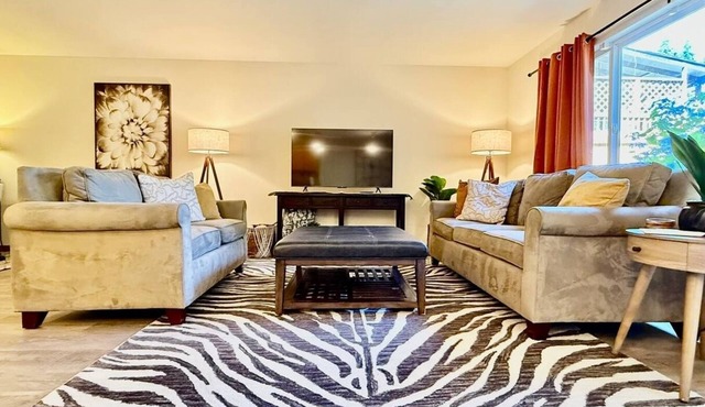 Spacious modern family home with open living, full kitchen, office nook, and private access