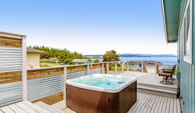 Updated Water View Gem with Deck, BBQ/Outdoor Dining, Hot Tub, Fireplace, & WiFi